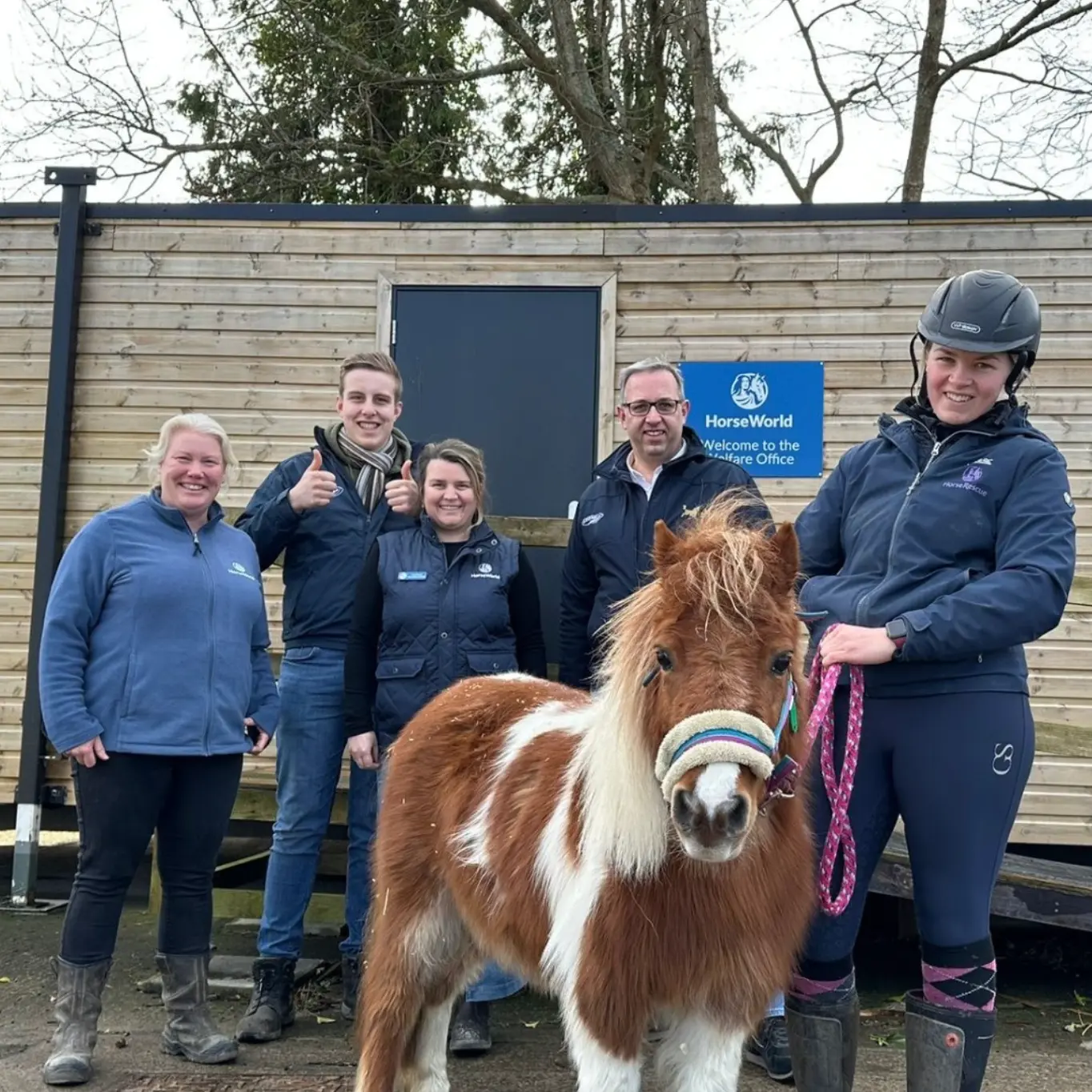 The Jelka Team at Horse World The Jelka Team pose for a photo, along with members of the HorseWorld Charity, after a successful visit to the charity. There is a small pony in the front of the picture.