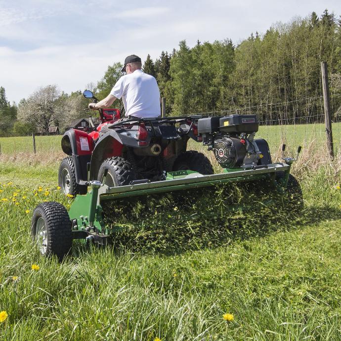 ATV Flail Mower cutting grass in the paddock with an atv flail mower