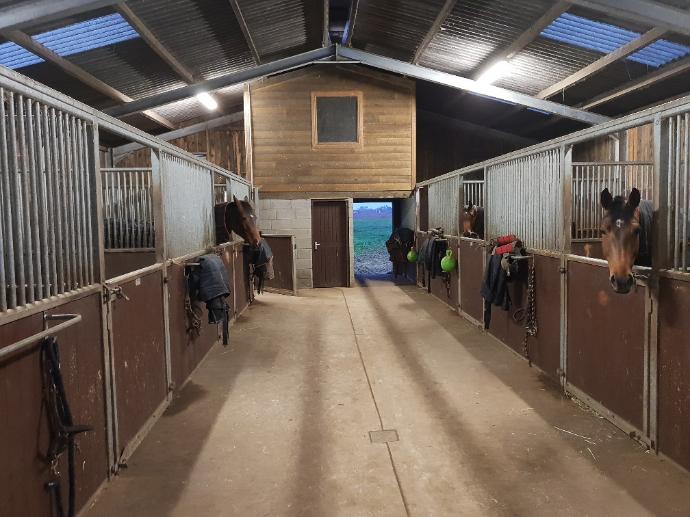 walkway through stables before rubber installation